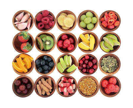 simsearch:400-08618279,k - Health super food selection for cold and flu remedy high in antioxidants, anthocyanins  and vitamins in wooden bowls over white background. Photographie de stock - Aubaine LD & Abonnement, Code: 400-08618387