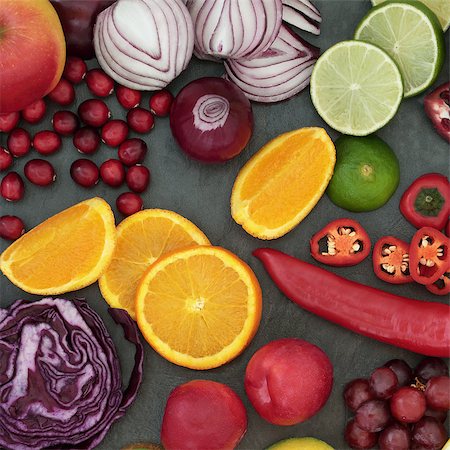 simsearch:400-08429907,k - Healthy fresh fruit and vegetable superfood background on slate, high in antioxidants, anthocyanins, vitamins, dietary fiber and minerals. Fotografie stock - Microstock e Abbonamento, Codice: 400-08618543