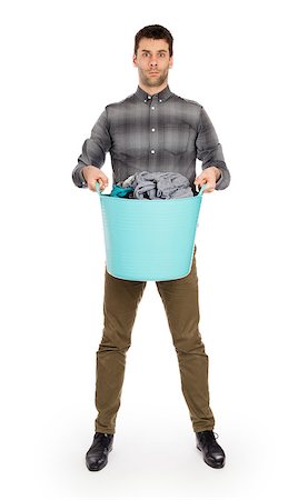 dirty clothes hamper - Full length portrait of a young man holding a laundry basket isolated on white background Foto de stock - Super Valor sin royalties y Suscripción, Código: 400-08619243