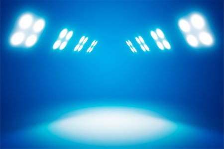 stage floodlight - Background in show. Blue interior shined with projector. Exhibition room with copy space Stock Photo - Budget Royalty-Free & Subscription, Code: 400-08624566