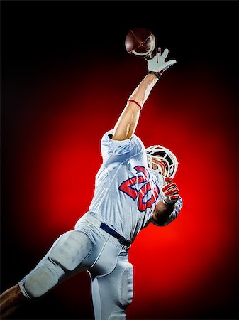 simsearch:400-08787080,k - one american football player man isolated on colorful black background Foto de stock - Super Valor sin royalties y Suscripción, Código: 400-08625501