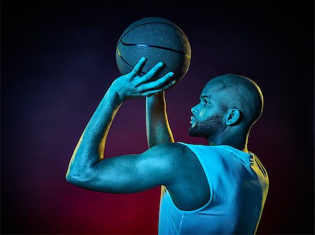 sports basketball portrait black background - one basketball player man Isolated on black background Stock Photo - Budget Royalty-Free & Subscription, Code: 400-08620322
