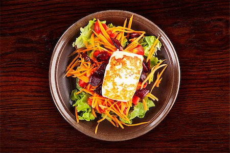 Grilled halloumi cheese with colorful fresh salad on plate on wooden table, top view. Culinary delicious vegetarian eating, mediterranean style. Stock Photo - Budget Royalty-Free & Subscription, Code: 400-08621764