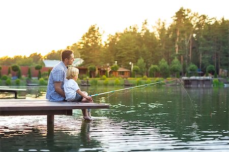 father and son fishing dock lake - Dad and son fishing outdoors Stock Photo - Budget Royalty-Free & Subscription, Code: 400-08623577