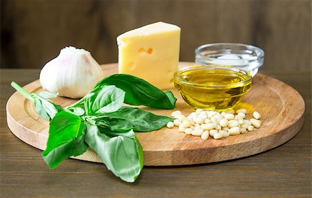 Sicilian basil pesto ingredients on wooden table Foto de stock - Super Valor sin royalties y Suscripción, Código: 400-08651396