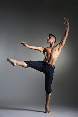 Young and stylish modern ballet dancer on grey background Photographie de stock - Aubaine LD & Abonnement, Code: 400-08668614
