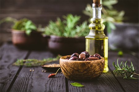 simsearch:400-05666507,k - Olive oil with herbs. Mediterranean ingredients: rosemary, olives, thyme, sage, salt, oregano Stock Photo - Budget Royalty-Free & Subscription, Code: 400-08668713