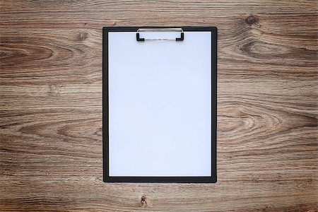 Blank white paper sheet A4 on clipboard on wooden background. Blackout frame. Top view Photographie de stock - Aubaine LD & Abonnement, Code: 400-08668837