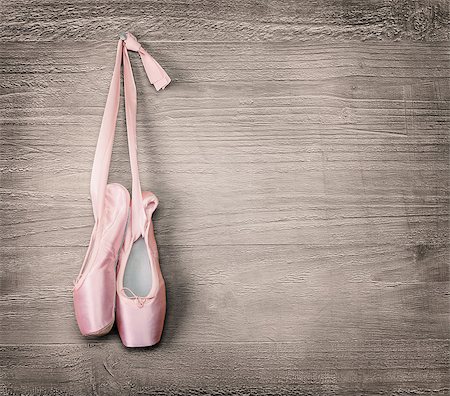 simsearch:400-07660010,k - New pink ballet shoes hanging on wooden background.Vintage style. Stock Photo - Budget Royalty-Free & Subscription, Code: 400-08668992