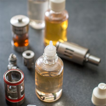 E cigarettes Liquid Bottle on table, close up Stock Photo - Budget Royalty-Free & Subscription, Code: 400-08669546