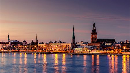 Riga, Latvia: Old Town of at night. The view from Daugava river Foto de stock - Super Valor sin royalties y Suscripción, Código: 400-08674138