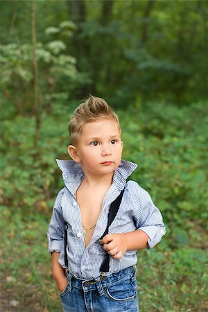 simsearch:400-07316542,k - Boy posing at the camera in a stylish dress Stock Photo - Budget Royalty-Free & Subscription, Code: 400-08678107