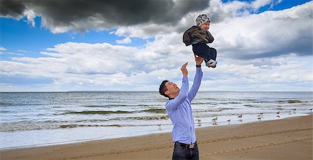 Father and son having  white sand beach  ocean Stock Photo - Budget Royalty-Free & Subscription, Code: 400-08670018