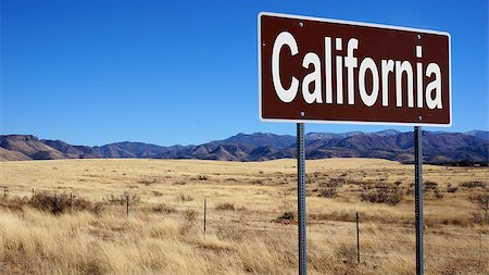 California road sign with blue sky and wilderness Foto de stock - Super Valor sin royalties y Suscripción, Código: 400-08670062