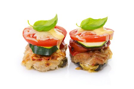 Roasted meat cutlets with tomato and zucchini isolated on the white. Stock Photo - Budget Royalty-Free & Subscription, Code: 400-08670278