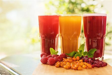 set of fruit non-alcoholic drink with cranberries raspberries and sea buckthorn Stock Photo - Budget Royalty-Free & Subscription, Code: 400-08671873