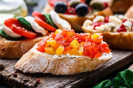 sandwich rustic table - Italian bruschetta with chopped tomatoes, herbs and oil on toasted crusty ciabatta bread Stock Photo - Budget Royalty-Free & Subscription, Code: 400-08694094