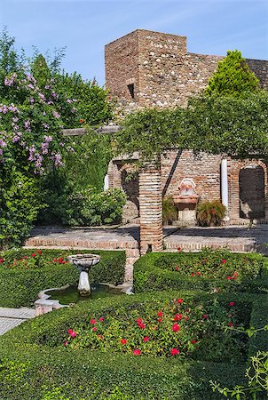 The Alcazaba is a palatial fortification in Malaga, Spain. Indoor garden Stock Photo - Budget Royalty-Free & Subscription, Code: 400-08694131