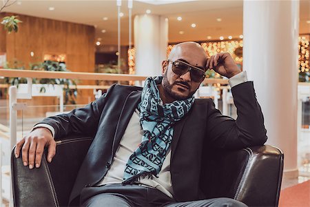 Arab businessman sitting on a sofa in an expensive hotel Photographie de stock - Aubaine LD & Abonnement, Code: 400-08694333