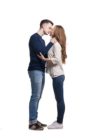 Young couple kissing against of white background.Isolated Stock Photo - Budget Royalty-Free & Subscription, Code: 400-08694435