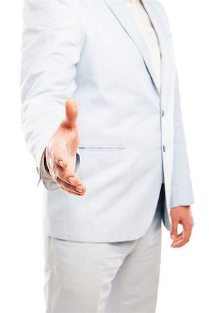 Close up of businessman wearing light suit extended his hand to handshake isolated on white background Stock Photo - Budget Royalty-Free & Subscription, Code: 400-08694437
