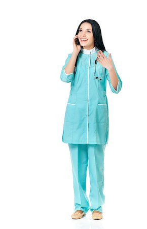 doctor speaking to young patient - Full length portrait of a young beautiful doctor with phone against white background. Stock Photo - Budget Royalty-Free & Subscription, Code: 400-08694714