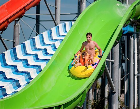 fotostok_pdv (artist) - Happy family - father with son - having fun water sliding at aqua park Foto de stock - Royalty-Free Super Valor e Assinatura, Número: 400-08694722