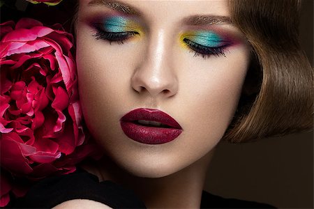 Beautiful girl with colorful make-up, flowers, retro hairstyle The beauty of the face. Photos shot in studio Photographie de stock - Aubaine LD & Abonnement, Code: 400-08695289