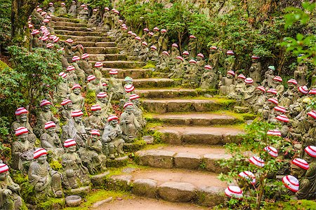 simsearch:400-04463989,k - Miyajima Island, Hiroshima, Japan at the buddha lined pathways at Daisho-in Temple grounds. Stock Photo - Budget Royalty-Free & Subscription, Code: 400-08695492