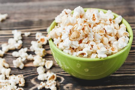 Sweet Caramel Popcorn in Green Bowl on Wooden Background, Selective Focus, Unhealthy Food Concept Stock Photo - Budget Royalty-Free & Subscription, Code: 400-08695621