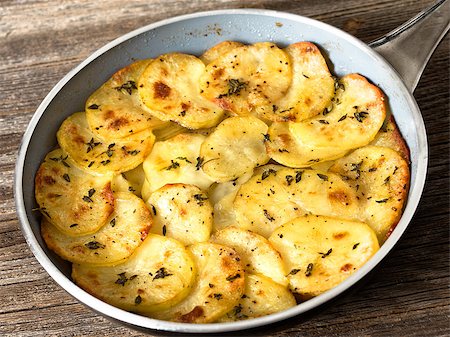 close up of rustic french golden anna potato Photographie de stock - Aubaine LD & Abonnement, Code: 400-08695791