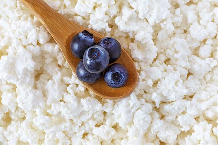 cottage cheese and the wooden spoon with blueberries Stock Photo - Budget Royalty-Free & Subscription, Code: 400-08695944