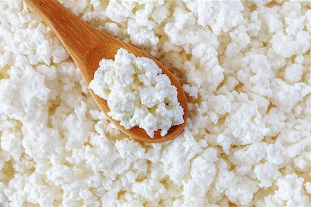 crumbly cottage cheese in the wooden spoon lying diagonally upwards Stock Photo - Budget Royalty-Free & Subscription, Code: 400-08695957