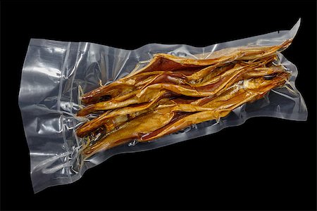 vacuum packed cold smoked Baikal omul on the black background Stock Photo - Budget Royalty-Free & Subscription, Code: 400-08696160