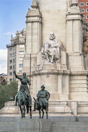 sculpture of Miguel de Cervantes and bronze sculptures of Don Quixote and Sancho Panza on Cervantes Monument, Madrid, Spain Foto de stock - Royalty-Free Super Valor e Assinatura, Número: 400-08696176