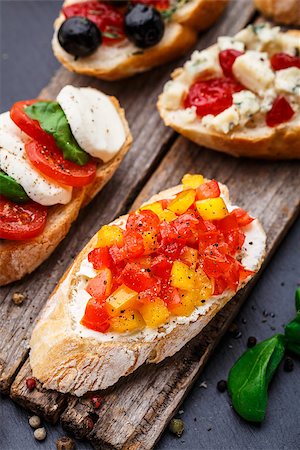 sandwich rustic table - Italian bruschetta with chopped tomatoes, herbs and oil on toasted crusty ciabatta bread Stock Photo - Budget Royalty-Free & Subscription, Code: 400-08693004