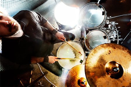 stage with band equipment - Man playing the drum.Live music background concept.Drummer and rock music Stock Photo - Budget Royalty-Free & Subscription, Code: 400-08693422