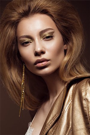 face glitter - Beautiful girl in a gold dress with creative makeup and hair. The beauty of the face. Photos shot in the studio. Foto de stock - Super Valor sin royalties y Suscripción, Código: 400-08693632