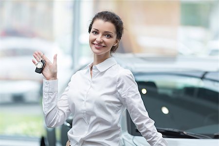 simsearch:400-06415950,k - Young woman with car keys indoors Stock Photo - Budget Royalty-Free & Subscription, Code: 400-08693692