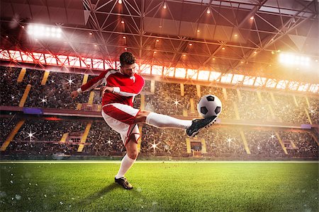 simsearch:400-09032434,k - Football player play in a stadium with audience Stockbilder - Microstock & Abonnement, Bildnummer: 400-08705607