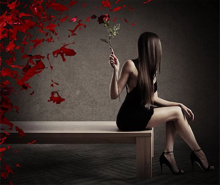 simsearch:625-02930713,k - Woman sitting on a table with a red rose Stock Photo - Budget Royalty-Free & Subscription, Code: 400-08705669