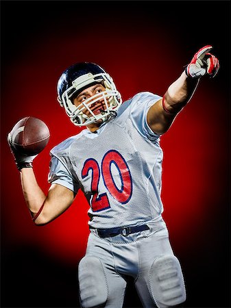 simsearch:400-08787080,k - one american football player man isolated on colorful black background Foto de stock - Super Valor sin royalties y Suscripción, Código: 400-08706019