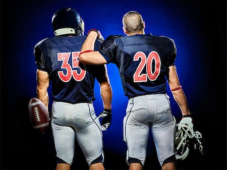 simsearch:400-08787080,k - two american football players men isolated on colorful black background Foto de stock - Super Valor sin royalties y Suscripción, Código: 400-08706020