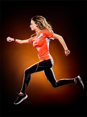 one caucasian young woman runner running jogger jogging isolated on black brackground Stock Photo - Budget Royalty-Free & Subscription, Code: 400-08706330