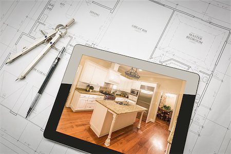 simsearch:400-08498867,k - Computer Tablet Showing Finished Kitchen Sitting On House Plans With Pencil and Compass. Foto de stock - Super Valor sin royalties y Suscripción, Código: 400-08706406