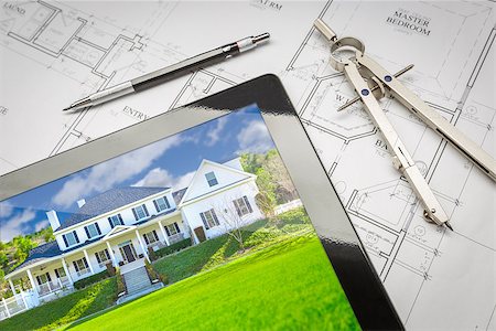 feverpitched (artist) - Computer Tablet Showing Finished House Sitting On House Plans With Pencil and Compass. Foto de stock - Royalty-Free Super Valor e Assinatura, Número: 400-08706401