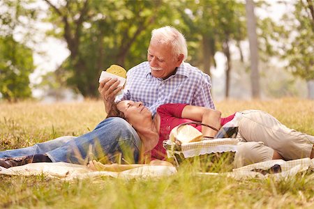Old people, senior couple, elderly man and woman in park. Retired seniors eating food at picnic Stock Photo - Budget Royalty-Free & Subscription, Code: 400-08706434