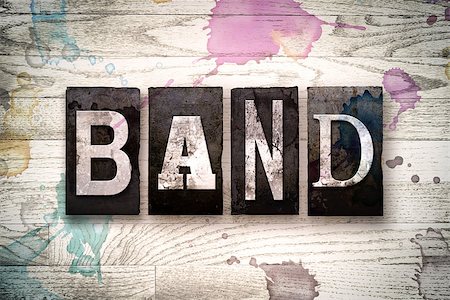 simsearch:400-08709089,k - The word "BAND" written in vintage dirty metal letterpress type on a whitewashed wooden background with ink and paint stains. Foto de stock - Royalty-Free Super Valor e Assinatura, Número: 400-08707699