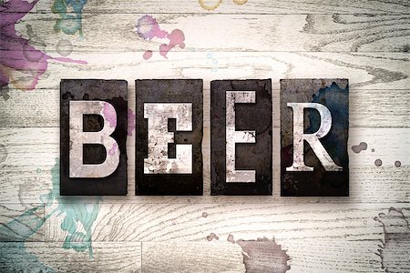 simsearch:400-08709089,k - The word "BEER" written in vintage dirty metal letterpress type on a whitewashed wooden background with ink and paint stains. Foto de stock - Royalty-Free Super Valor e Assinatura, Número: 400-08707700