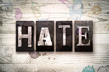 racist - The word "HATE" written in vintage dirty metal letterpress type on a whitewashed wooden background with ink and paint stains. Stock Photo - Budget Royalty-Free & Subscription, Code: 400-08707938